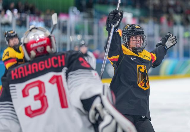 (260207) -- MILAN, Feb. 7, 2026 (Xinhua) -- Daria Gleissner (R) of Germany celebrates her score during the ice hockey women's preliminary round group B match between Germany and Japan of the Milan-Cortina 2026 Olympic Winter Games in Milan, Italy, Feb. 7, 2026. (Xinhua/Sun Fei)