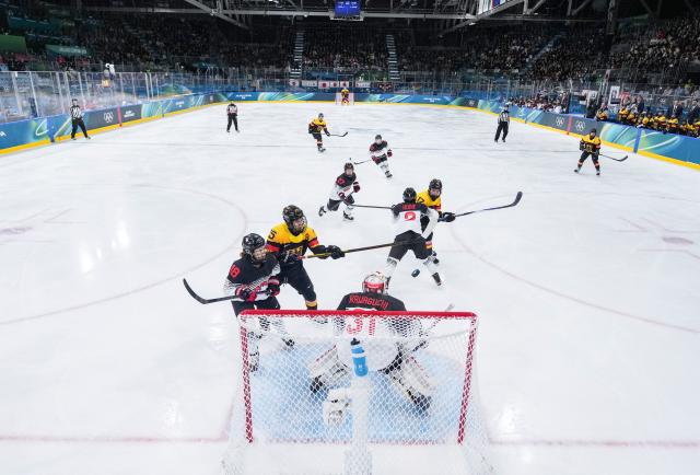 (260207) -- MILAN, Feb. 7, 2026 (Xinhua) -- Laura Kluge (2nd L) of Germany shoots to score during the ice hockey women's preliminary round group B match between Germany and Japan of the Milan-Cortina 2026 Olympic Winter Games in Milan, Italy, Feb. 7, 2026. (Xinhua/Sun Fei)