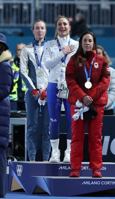 (260207) -- MILAN, Feb. 7, 2026 (Xinhua) -- Gold medalist Francesca Lollobrigida (C) of Italy, silver medalist Ragne Wiklund (L) of Norway and bronze medalist Valerie Maltais of Canada attend the awarding ceremony of the speed skating women's 3000m at the Milan-Cortina 2026 Olympic Winter Games in Milan, Italy, Feb. 7, 2026. (Xinhua/Li Jing)
