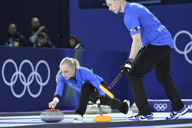 (260207) -- CORTINA D'AMPEZZO, Feb. 7, 2026 (Xinhua) -- Marie Kaldvee (L) and Harri Lill of Estonia compete during the curling mixed doubles round robin session 8 match of the 2026 Milan-Cortina Winter Olympics in Cortina D'Ampezzo, Italy, Feb. 7, 2026. (Xinhua/Lian Yi)