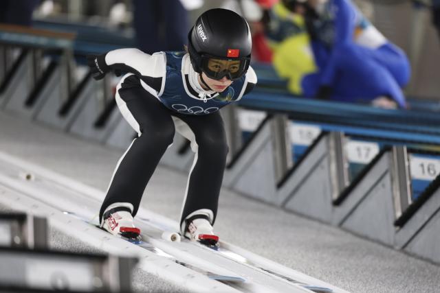(260207) -- PREDAZZO, Feb. 7, 2026 (Xinhua) -- Dong Bing of China competes during the ski jumping women's normal hill individual at the Milan-Cortina 2026 Olympic Winter Games in Predazzo, Italy, Feb. 7, 2026. (Xinhua/Huang Wei)