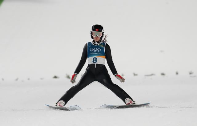 (260207) -- PREDAZZO, Feb. 7, 2026 (Xinhua) -- Weng Yangning of China competes during the ski jumping women's normal hill individual at the Milan-Cortina 2026 Olympic Winter Games in Predazzo, Italy, Feb. 7, 2026. (Xinhua/Meng Yongmin)
