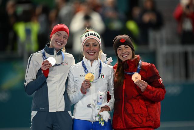 (260207) -- MILAN, Feb. 7, 2026 (Xinhua) -- Gold medalist Francesca Lollobrigida (C) of Italy, silver medalist Ragne Wiklund (L) of Norway and bronze medalist Valerie Maltais of Canada attend the awarding ceremony of the speed skating women's 3000m at the Milan-Cortina 2026 Olympic Winter Games in Milan, Italy, Feb. 7, 2026. (Xinhua/Wu Wei)