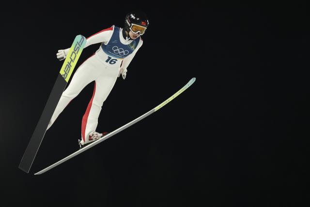 (260207) -- PREDAZZO, Feb. 7, 2026 (Xinhua) -- Liu Qi of China competes during the first round of the ski jumping women's normal hill individual at the Milan-Cortina 2026 Olympic Winter Games in Predazzo, Italy, Feb. 7, 2026. (Xinhua/Huang Wei)