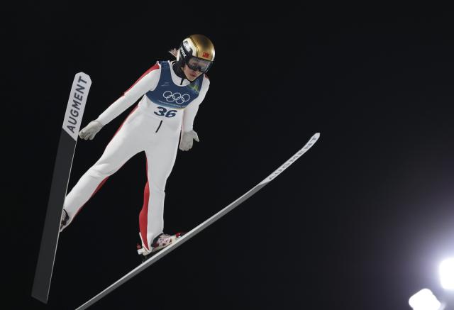 (260207) -- PREDAZZO, Feb. 7, 2026 (Xinhua) -- Zeng Ping of China competes during the first round of the ski jumping women's normal hill individual at the Milan-Cortina 2026 Olympic Winter Games in Predazzo, Italy, Feb. 7, 2026. (Xinhua/Huang Wei)