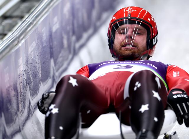 (260207) -- CORTINA D'AMPEZZO, Feb. 7, 2026 (Xinhua) -- Kristers Aparjods of Latvia competes during the luge men's singles run 1 at the Milan-Cortina 2026 Olympic Winter Games in Cortina, Italy, Feb. 7, 2026. (Xinhua/Ding Xu)