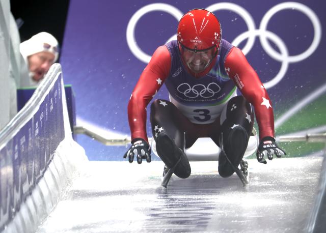 (260207) -- CORTINA D'AMPEZZO, Feb. 7, 2026 (Xinhua) -- Kristers Aparjods of Latvia competes during the luge men's singles run 1 at the Milan-Cortina 2026 Olympic Winter Games in Cortina, Italy, Feb. 7, 2026. (Xinhua/Ding Xu)