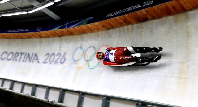 (260207) -- CORTINA D'AMPEZZO, Feb. 7, 2026 (Xinhua) -- Kristers Aparjods of Latvia competes during the luge men's singles run 2 at the Milan-Cortina 2026 Olympic Winter Games in Cortina, Italy, Feb. 7, 2026. (Xinhua/Ding Xu)