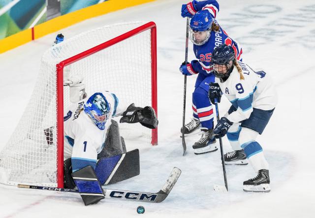 (260207) -- MILAN, Feb. 7, 2026 (Xinhua) -- Sanni Ahola (L) of Finland saves a goal during the ice hockey women's preliminary round group A match between the United States and Finland at the Milan-Cortina 2026 Olympic Winter Games in Milan, Italy, Feb. 7, 2026. (Xinhua/Sun Fei)