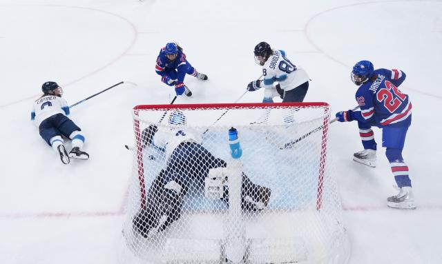 (260207) -- MILAN, Feb. 7, 2026 (Xinhua) -- Sanni Ahola (bottom) of Finland defends during the ice hockey women's preliminary round group A match between the United States and Finland at the Milan-Cortina 2026 Olympic Winter Games in Milan, Italy, Feb. 7, 2026. (Xinhua/Tao Xiyi)