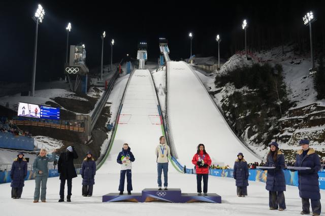 (260207) -- PREDAZZO, Feb. 7, 2026 (Xinhua) -- Gold medalist Anna Odine Stroem of Norway, silver medalist Nika Prevc of Slovenia and bronze medalist Maruyama Nozomi of Japan attend the awarding ceremony of ski jumping women's normal hill individual at the Milan-Cortina 2026 Olympic Winter Games in Predazzo, Italy, Feb. 7, 2026. (Xinhua/Meng Yongmin)