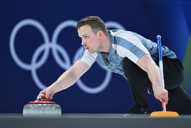 (260207) -- CORTINA D'AMPEZZO, Feb. 7, 2026 (Xinhua) -- Magnus Nedregotten of Norway competes during the curling mixed doubles round robin session 9 match between Italy and Norway at the Milan-Cortina 2026 Olympic Winter Games in Cortina D'Ampezzo, Italy, Feb. 7, 2026. (Xinhua/Lian Yi)