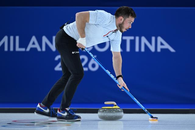 (260207) -- CORTINA D'AMPEZZO, Feb. 7, 2026 (Xinhua) -- Korey Dropkin of the United States competes during the curling mixed doubles round robin session 9 match between South Korea and the United States at the Milan-Cortina 2026 Olympic Winter Games in Cortina D'Ampezzo, Italy, Feb. 7, 2026. (Xinhua/Lian Yi)