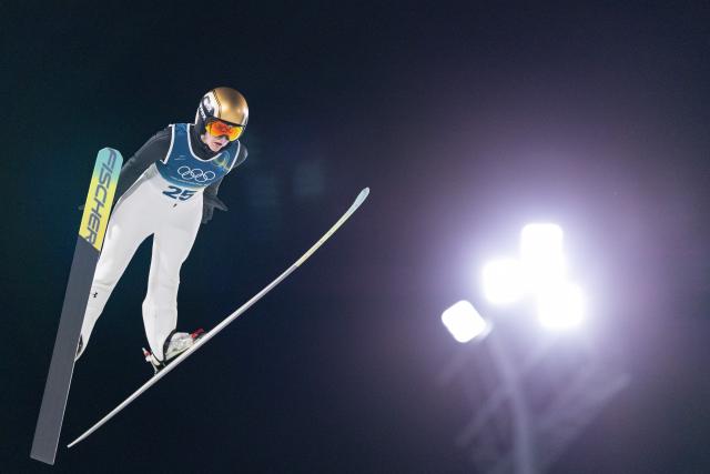 (260208) -- PREDAZZO, Feb. 8, 2026 (Xinhua) -- Katra Komar of Slovenia competes during the Ski Jumping Women's Normal Hill Individual of the 2026 Milan-Cortina Winter Olympics in Predazzo, Italy, Feb. 7, 2026. (Xinhua/Huang Wei)