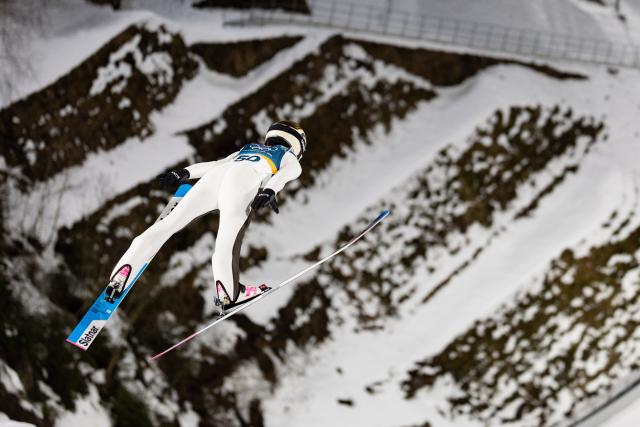 (260208) -- PREDAZZO, Feb. 8, 2026 (Xinhua) -- Nika Prevc of Slovenia competes during the Ski Jumping Women's Normal Hill Individual of the 2026 Milan-Cortina Winter Olympics in Predazzo, Italy, Feb. 7, 2026. (Xinhua/Huang Wei)