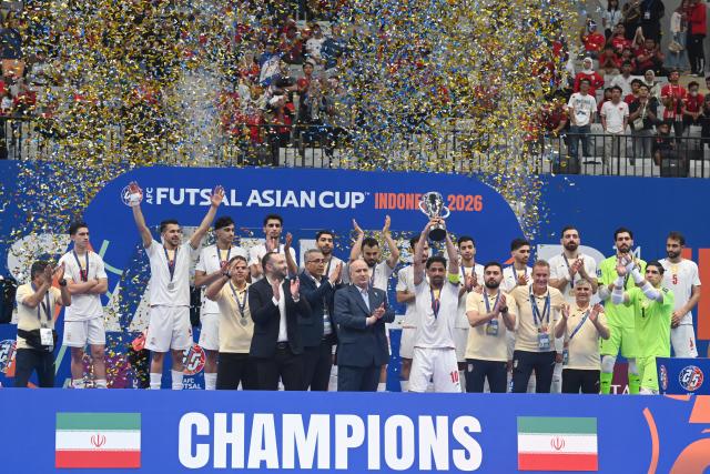 (260208) -- JAKARTA, Feb. 8, 2026 (Xinhua) -- Gold medalists team Iran celebrate during the awarding ceremony after the final match between Indonesia and Iran at the AFC Futsal Asian Cup 2026 in the Indonesia Arena stadium, Jakarta, Indonesia, Feb. 7, 2026. (Xinhua/Agung Kuncahya B.)