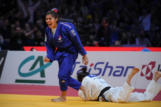 (260208) -- PARIS, Feb. 8, 2026 (Xinhua) -- Shirine Boukli (L) of France reacts during the Grand Slam judo tournament women's -48kg final match against Zhuang Wenna of China in Paris, France, Feb. 7, 2026. (Photo by Aurelien Morissard/Xinhua)