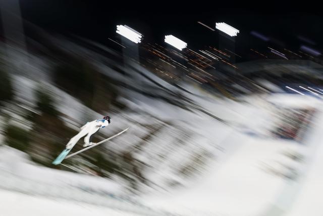 (260208) -- BEIJING, Feb. 8, 2026 (Xinhua) -- Josie Johnson of the United States competes during the Ski Jumping Women's Normal Hill Individual of the 2026 Milan-Cortina Winter Olympics in Predazzo, Italy, Feb. 7, 2026. (Xinhua/Huang Wei)