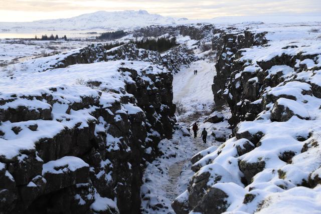 (260208) -- REYKJAVIK, Feb. 8, 2026 (Xinhua) -- Tourists walk among rocky cliffs at Thingvellir National Park on Iceland on Feb. 7, 2026. (Xinhua/Zhu Haochen)