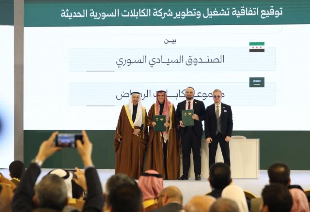 (260208) -- DAMASCUS, Feb. 8, 2026 (Xinhua) -- Officials display signed agreements during a ceremony announcing Syrian-Saudi strategic agreements at the People's Palace in Damascus, Syria, on Feb. 7, 2026.
  Syria and Saudi Arabia on Saturday announced a series of strategic agreements, including establishing a joint airline, marking a significant step toward expanding economic cooperation.
  TO GO WITH "Syria, Saudi Arabia sign strategic deals, launch joint airline to boost investment, connectivity" (Photo by Ammar Safarjalani/Xinhua)