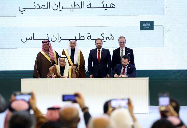 (260208) -- DAMASCUS, Feb. 8, 2026 (Xinhua) -- Officials from Syria and Saudi Arabia sign an aviation agreement during a ceremony announcing Syrian-Saudi strategic agreements at the People's Palace in Damascus, Syria, on Feb. 7, 2026.
  Syria and Saudi Arabia on Saturday announced a series of strategic agreements, including establishing a joint airline, marking a significant step toward expanding economic cooperation.
  TO GO WITH "Syria, Saudi Arabia sign strategic deals, launch joint airline to boost investment, connectivity" (Photo by Ammar Safarjalani/Xinhua)