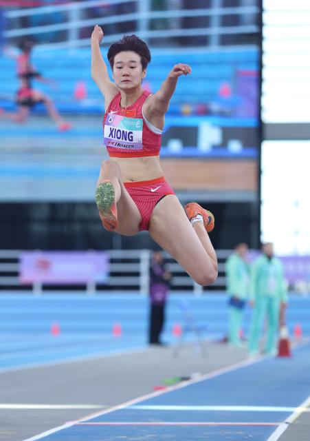 (260208) -- TIANJIN, Feb. 8, 2026 (Xinhua) -- Xiong Shiqi of China competes during the women's long jump final at the 12th Asian Indoor Athletics Championships 2026 in Tianjin, north China, Feb. 8, 2026. (Xinhua/Sun Fanyue)