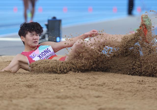 (260208) -- TIANJIN, Feb. 8, 2026 (Xinhua) -- Xiong Shiqi of China competes during the women's long jump final at the 12th Asian Indoor Athletics Championships 2026 in Tianjin, north China, Feb. 8, 2026. (Xinhua/Sun Fanyue)