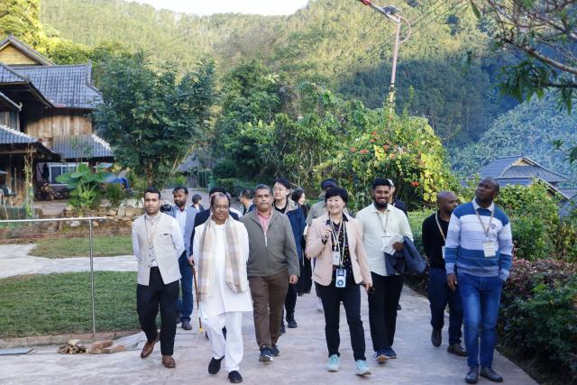 (260208) -- KUNMING, Feb. 8, 2026 (Xinhua) -- People from Global South countries visit Hebian Village in Mengla County, southwest China's Yunnan Province, Dec. 5, 2025. TO GO WITH "China Focus: Global South youth explore rural development models in SW China's Yunnan" (Xinhua)