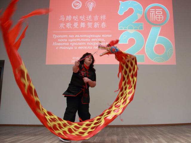 (260208) -- SOFIA, Feb. 8, 2026 (Xinhua) -- A Bulgarian schoolgirl performs a dragon dance during a celebration of the upcoming Chinese New Year at the Confucius Institute in Sofia, Bulgaria, Feb. 7, 2026. (Photo by Marian Draganov/Xinhua)