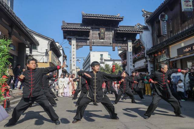(260208) -- JIANDE, Feb. 8, 2026 (Xinhua) -- People perform martial arts at Shouchang ancient town in Jiande, east China's Zhejiang Province, Feb. 8, 2026. Shouchang ancient town has recently held traditional folk activities such as folk parades, dragon and lion dances, and a lantern show to welcome the Chinese New Year. (Xinhua/Xu Yu)
