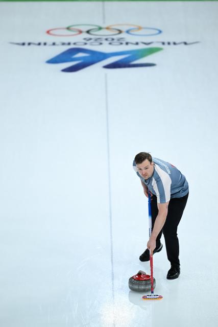 (260208) -- CORTINA D'AMPEZZO, Feb. 8, 2026 (Xinhua) -- Magnus Nedregotten of Norway competes against Julie Zelingrova/Vit Chabicovsky of the Czech Republic during the curling mixed doubles round robin session 10 match of the 2026 Milan-Cortina Winter Olympics in Cortina D'Ampezzo, Italy, Feb. 8, 2026. (Xinhua/Lian Yi)