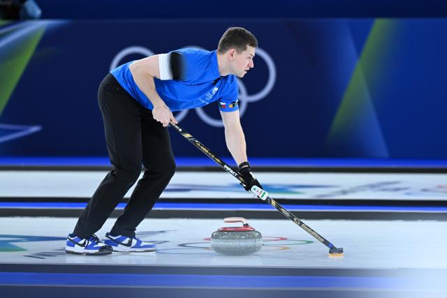 (260208) -- CORTINA D'AMPEZZO, Feb. 8, 2026 (Xinhua) -- Harri Lill of Estonia competes against Kim Seon-yeong/Jeong Yeong-seok of South Korea during the curling mixed doubles round robin session 10 match of the 2026 Milan-Cortina Winter Olympics in Cortina D'Ampezzo, Italy, Feb. 8, 2026. (Xinhua/Lian Yi)