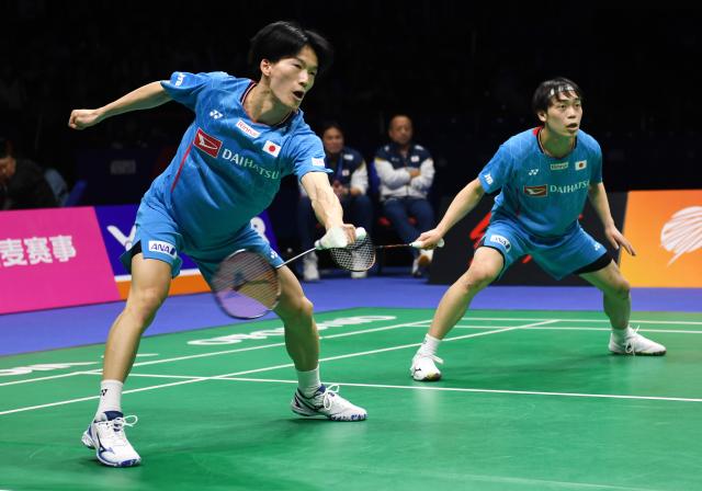 (260208) -- QINGDAO, Feb. 8, 2026 (Xinhua) -- Kumagai Kakeru (L)/Nishi Hiroki of Japan compete against He Jiting/Ren Xiangyu of China during the men's team final match between China and Japan at Badminton Asia Team Championships 2026 in Qingdao, east China's Shandong Province, Feb. 8, 2026. (Xinhua/Li Ziheng)