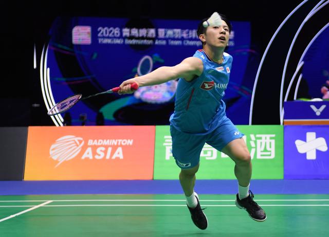 (260208) -- QINGDAO, Feb. 8, 2026 (Xinhua) -- Watanabe Koki of Japan hits a return against Zhu Xuanchen of China during the men's team final match between China and Japan at Badminton Asia Team Championships 2026 in Qingdao, east China's Shandong Province, Feb. 8, 2026. (Xinhua/Li Ziheng)