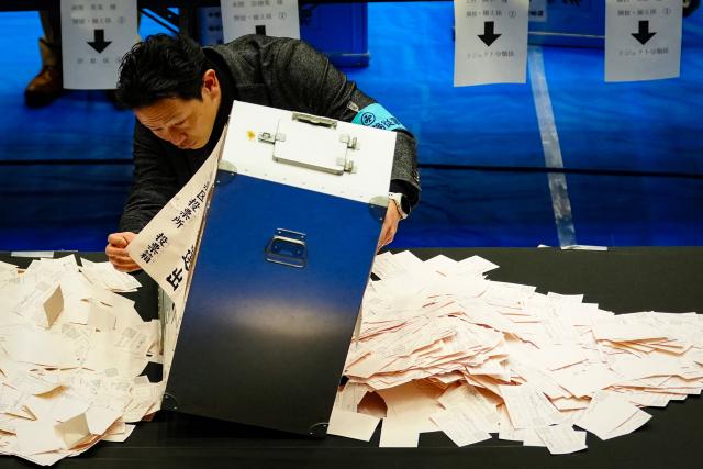 (260208) -- TOKYO, Feb. 8, 2026 (Xinhua) -- A staff member opens a ballot box at a counting station for the general election in Tokyo, Japan, Feb. 8, 2026. Japan's ruling coalition of Liberal Democratic Party (LDP) and its partner Japan Innovation Party is expected to secure a majority of seats in the House of Representatives in Sunday's general election, public broadcaster NHK said, citing its exit poll. (Xinhua/Jia Haocheng)