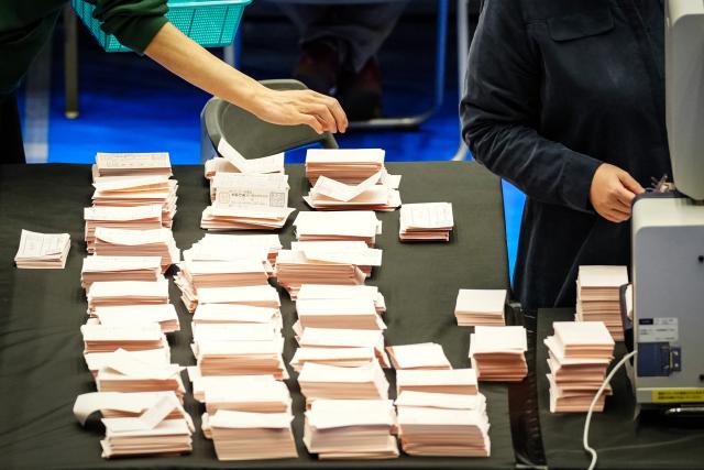 (260208) -- TOKYO, Feb. 8, 2026 (Xinhua) -- Staff members sort ballots at a counting station for the general election in Tokyo, Japan, Feb. 8, 2026. Japan's ruling coalition of Liberal Democratic Party (LDP) and its partner Japan Innovation Party is expected to secure a majority of seats in the House of Representatives in Sunday's general election, public broadcaster NHK said, citing its exit poll. (Xinhua/Jia Haocheng)