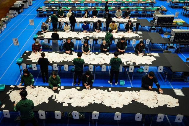 (260208) -- TOKYO, Feb. 8, 2026 (Xinhua) -- Staff members sort ballots at a counting station for the general election in Tokyo, Japan, Feb. 8, 2026. Japan's ruling coalition of Liberal Democratic Party (LDP) and its partner Japan Innovation Party is expected to secure a majority of seats in the House of Representatives in Sunday's general election, public broadcaster NHK said, citing its exit poll. (Xinhua/Jia Haocheng)