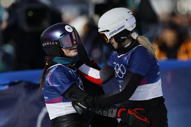 (260208) -- LIVIGNO, Feb. 8, 2026 (Xinhua) -- Gold medalist Zuzana Maderova (L) of the Czech Republic greets silver medalist Sabine Payer of Austria after the Snowboard Women's Parallel Giant Slalom Finals at the Milan-Cortina 2026 Olympic Winter Games in Livigno, Italy, Feb. 8, 2026. (Xinhua/Wang Peng)