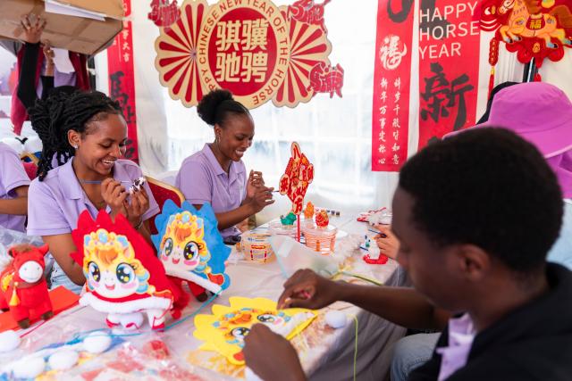(260208) -- NAIROBI, Feb. 8, 2026 (Xinhua) -- People make handicraft works at the 2026 Chinese New Year Gala in Nairobi, Kenya, Feb. 8, 2026. Kenya on Sunday celebrated the 2026 Chinese New Year Gala in Nairobi, bringing together dignitaries including senior government officials, diplomats, industry leaders, and hundreds of local and foreign visitors.
   The day-long event, held at Two Rivers Mall, featured cultural performances such as dragon and lion dances, contemporary music, and showcases of Chinese costumes and cuisine. (Xinhua/Xie Jianfei)