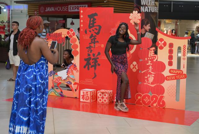 (260208) -- NAIROBI, Feb. 8, 2026 (Xinhua) -- People take photos at the 2026 Chinese New Year Gala in Nairobi, Kenya, Feb. 8, 2026. Kenya on Sunday celebrated the 2026 Chinese New Year Gala in Nairobi, bringing together dignitaries including senior government officials, diplomats, industry leaders, and hundreds of local and foreign visitors.
   The day-long event, held at Two Rivers Mall, featured cultural performances such as dragon and lion dances, contemporary music, and showcases of Chinese costumes and cuisine. (Xinhua/Yang Guang)