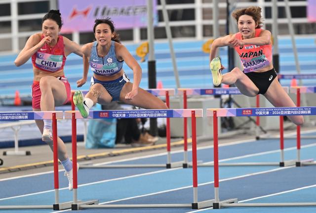 (260208) -- TIANJIN, Feb. 8, 2026 (Xinhua) -- Zhang Boya (C) of Chinese Taipei competes during the women's 60m hurdles final at the 12th Asian Indoor Athletics Championships 2026 in Tianjin, north China, Feb. 8, 2026. (Xinhua/Li Ran)