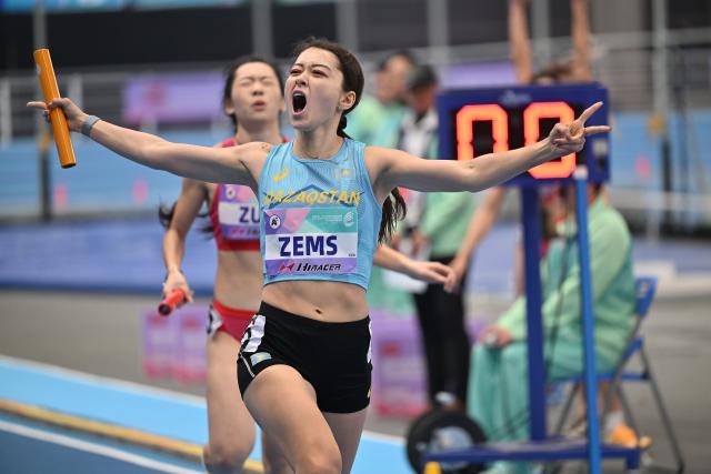(260208) -- TIANJIN, Feb. 8, 2026 (Xinhua) -- Adelina Zems of Kazakhstan celebrates after the women's 4x400m relay final at the 12th Asian Indoor Athletics Championships 2026 in Tianjin, north China, Feb. 8, 2026. (Xinhua/Li Ran)