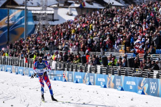 (260208) -- TESERO, Feb. 8, 2026 (Xinhua) -- Stevenson Savart of Haiti competes during the cross-country skiing men's 10km+10km skiathlon at the Milan-Cortina 2026 Olympic Winter Games in Tesero, Italy, Feb. 8, 2026. (Xinhua/Peng Ziyang)