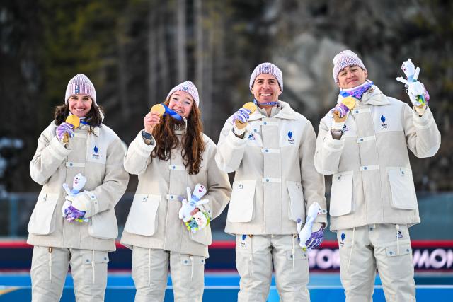 (260208) -- ANTERSELVA, Feb. 8, 2026 (Xinhua) -- Julia Simon, Lou Jeanmonnot, Quentin Fillon Maillet and Eric Perrot (L-R) of France celebrate during the awarding ceremony of the biathlon mixed relay 4 x 6km (M+W) at the Milan-Cortina 2026 Olympic Winter Games in Anterselva, Italy, Feb. 8, 2026. (Xinhua/Jiang Han)