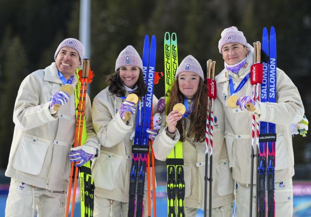 (260208) -- ANTERSELVA, Feb. 8, 2026 (Xinhua) -- Julia Simon (2nd L), Lou Jeanmonnot (2nd R), Quentin Fillon Maillet (1st L), and Eric Perrot of France pose for photos during the awarding ceremony of the biathlon mixed relay 4 x 6km (M+W) at the Milan-Cortina 2026 Olympic Winter Games in Anterselva, Italy, Feb. 8, 2026. (Xinhua/Jiang Han)