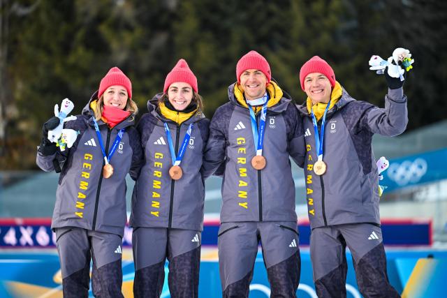 (260208) -- ANTERSELVA, Feb. 8, 2026 (Xinhua) -- Bronze medalists Franziska Preuss (1st L), Vanessa Voigt (2nd L), Philipp Nawrath (2nd R) and Justus Strelow of Germany attend the awarding ceremony of the biathlon mixed relay 4 x 6km (M+W) at the Milan-Cortina 2026 Olympic Winter Games in Anterselva, Italy, Feb. 8, 2026. (Xinhua/Jiang Han)