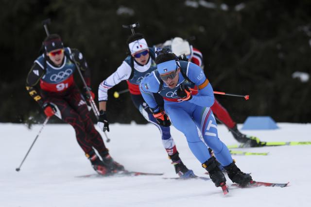(260208) -- ANTERSELVA, Feb. 8, 2026 (Xinhua) -- Tommaso Giacomel (front) of Italy, Eric Perrot (2nd L) of France and Justus Strelow (1st L) of Germany compete during the biathlon mixed relay 4 x 6km (M+W) at the Milan-Cortina 2026 Olympic Winter Games in Anterselva, Italy, Feb. 8, 2026. (Xinhua/Zhang Tao)