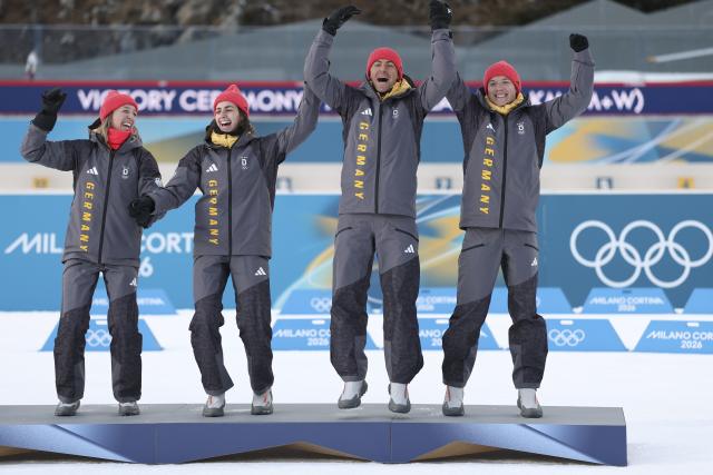 (260208) -- ANTERSELVA, Feb. 8, 2026 (Xinhua) -- Bronze medalists Franziska Preuss (1st L), Vanessa Voigt (2nd L), Philipp Nawrath (2nd R) and Justus Strelow of Germany celebrate during the awarding ceremony of the biathlon mixed relay 4 x 6km (M+W) at the Milan-Cortina 2026 Olympic Winter Games in Anterselva, Italy, Feb. 8, 2026. (Xinhua/Zhang Tao)