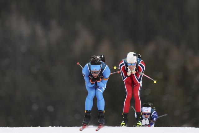 (260208) -- ANTERSELVA, Feb. 8, 2026 (Xinhua) -- Tommaso Giacomel (front) of Italy competes during the biathlon mixed relay 4 x 6km (M+W) at the Milan-Cortina 2026 Olympic Winter Games in Anterselva, Italy, Feb. 8, 2026. (Xinhua/Zhang Tao)