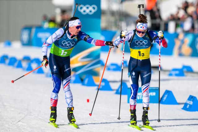 (260208) -- ANTERSELVA, Feb. 8, 2026 (Xinhua) -- Quentin Fillon Maillet (L) and Lou Jeanmonnot of France compete during the biathlon mixed relay 4 x 6km (M+W) at the Milan-Cortina 2026 Olympic Winter Games in Anterselva, Italy, Feb. 8, 2026. (Xinhua/Jiang Han)